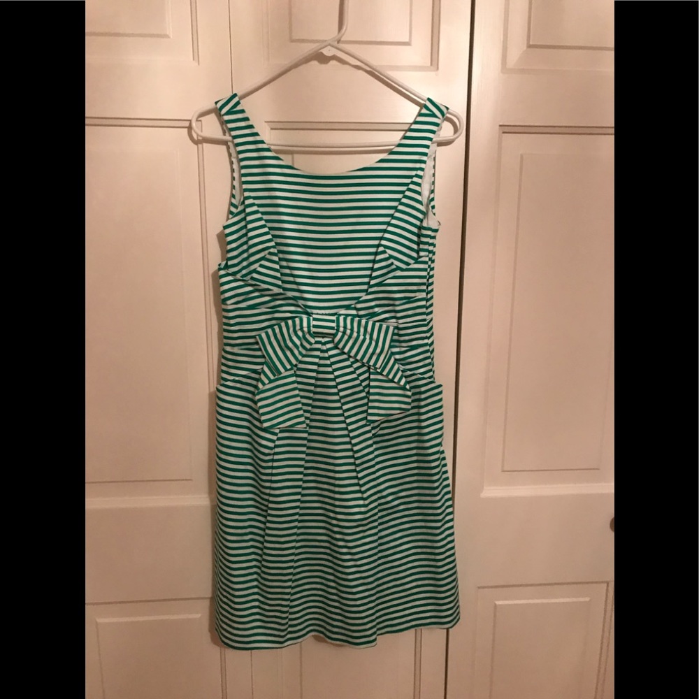 Green and white woman’s sundress